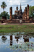 Thailand, Old Sukhothai - Wat Mahathat, the remains of a bot with a large seated Buddha. 